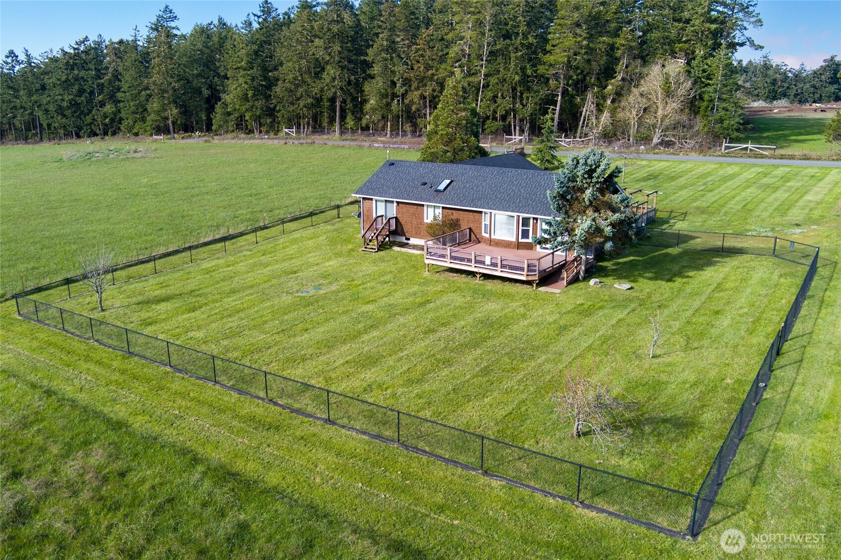 549 Davis Bay Road Lopez Island, WA 98261 - Photo 3 of 34 a view of a house with a big yard