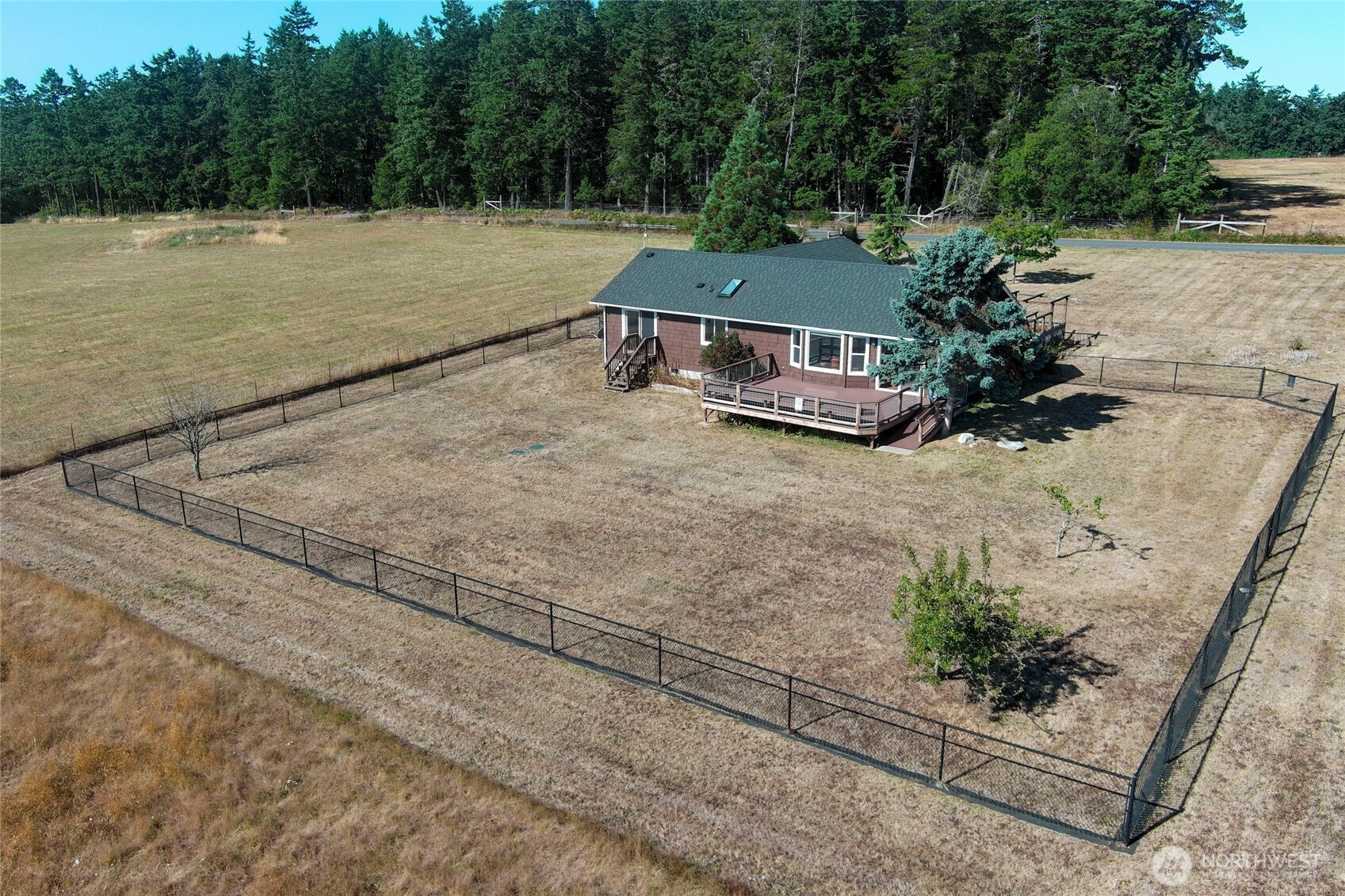 549 Davis Bay Road Lopez Island, WA 98261 - Photo 3 of 37 an aerial view of a house with a yard