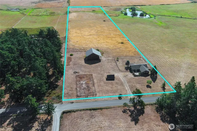 a aerial view of a house with a yard