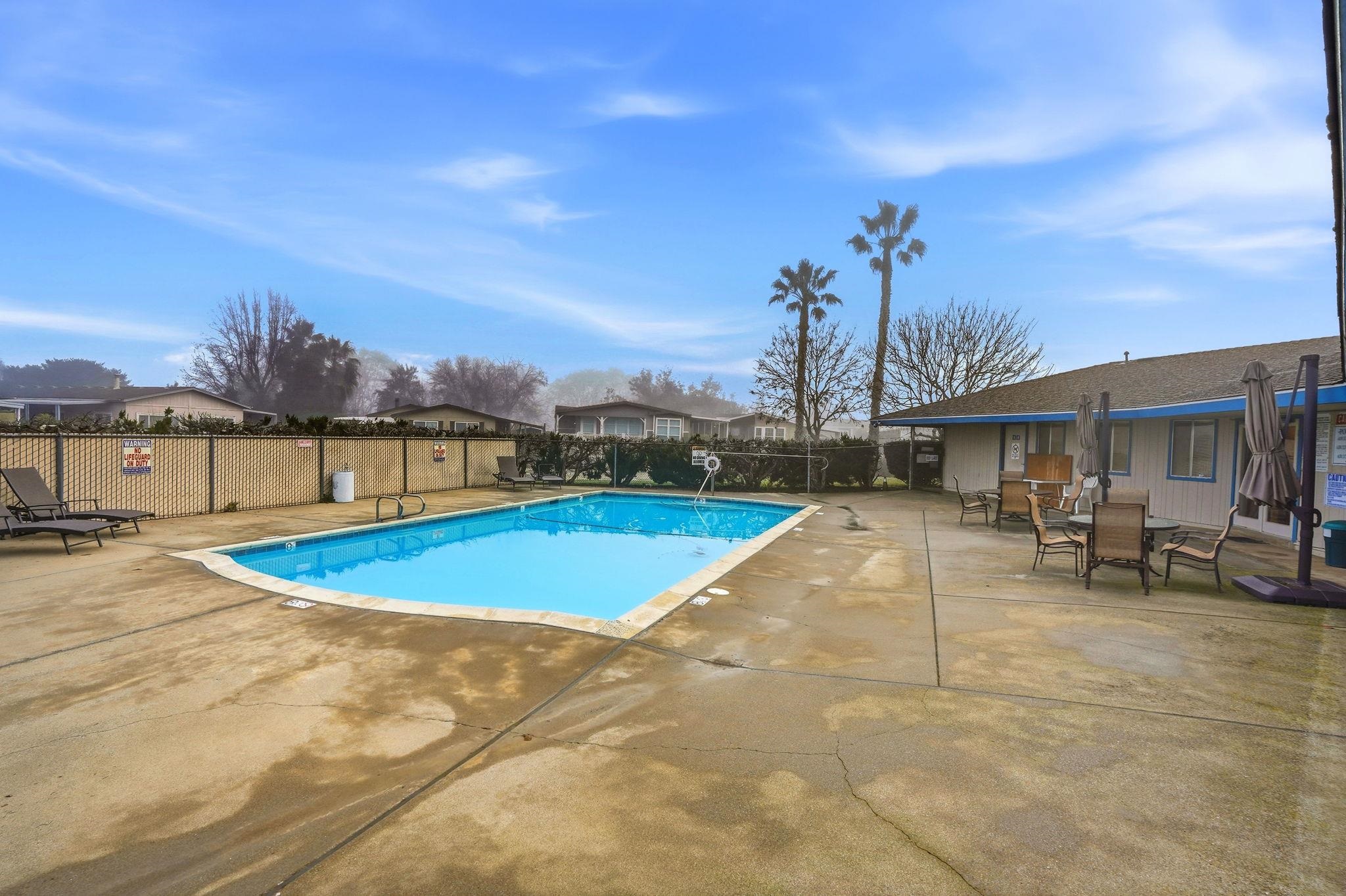 4603 Balfour Road, Unit 12 Brentwood, CA 94513 - Photo 36 of 36 a view of a swimming pool with lawn chairs