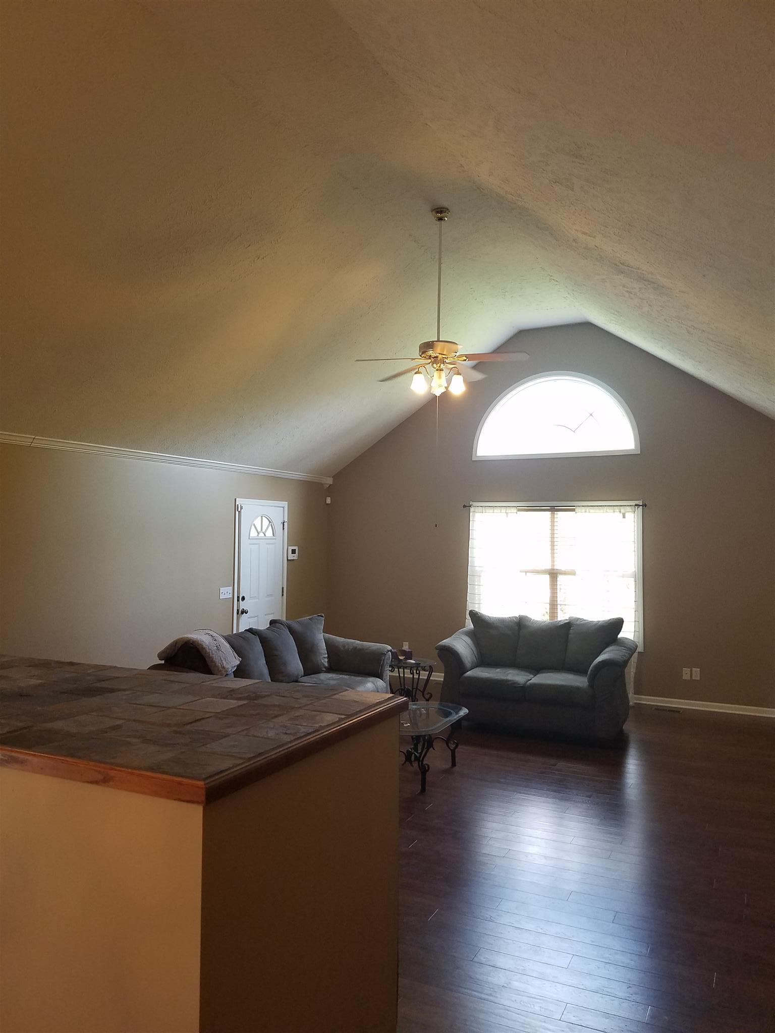 337 Brandon Road Manchester, TN 37355 - Photo 11 of 16 a living room with furniture and a chandelier