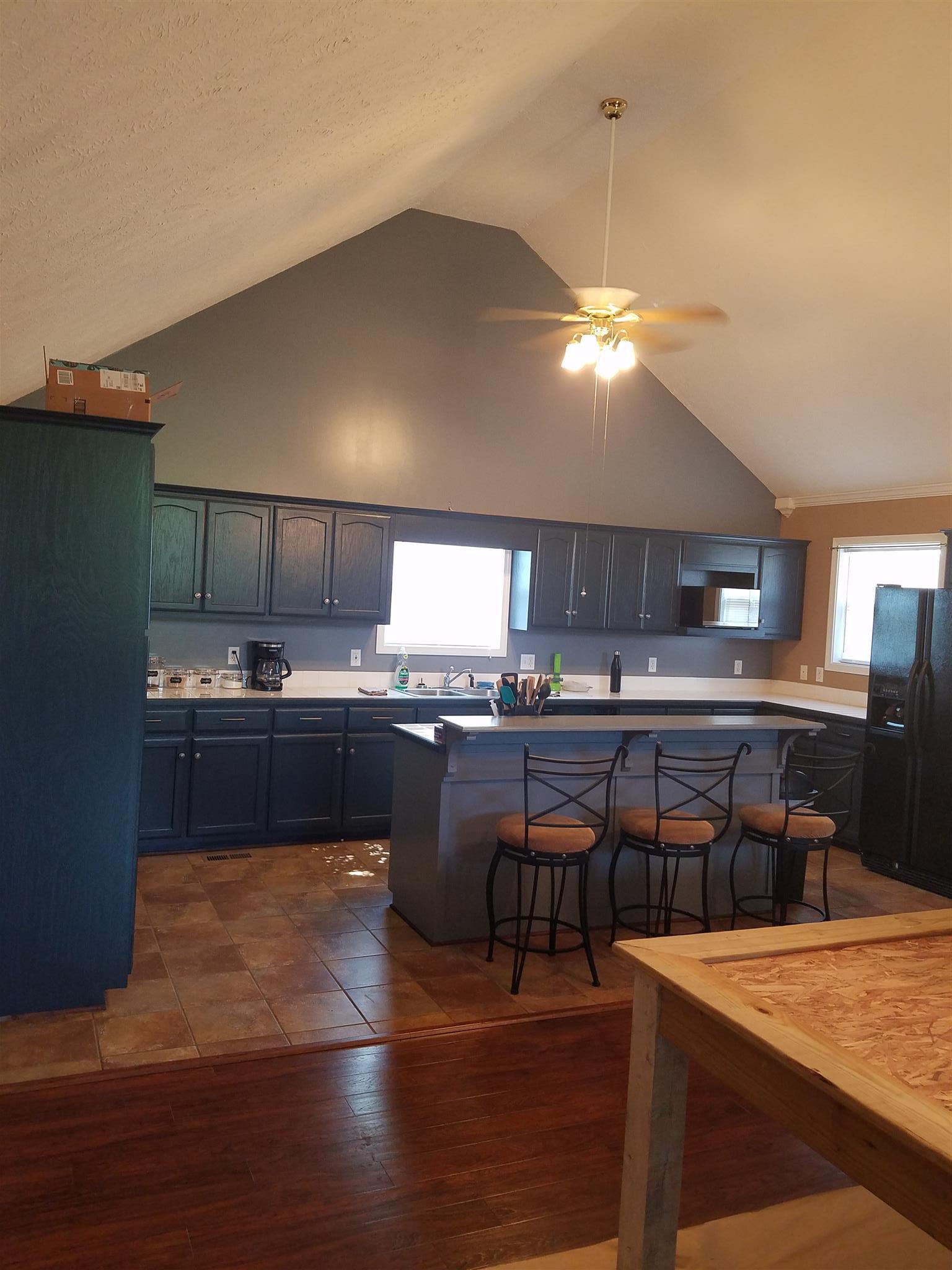 337 Brandon Road Manchester, TN 37355 - Photo 8 of 16 a kitchen with a table chairs and white cabinets