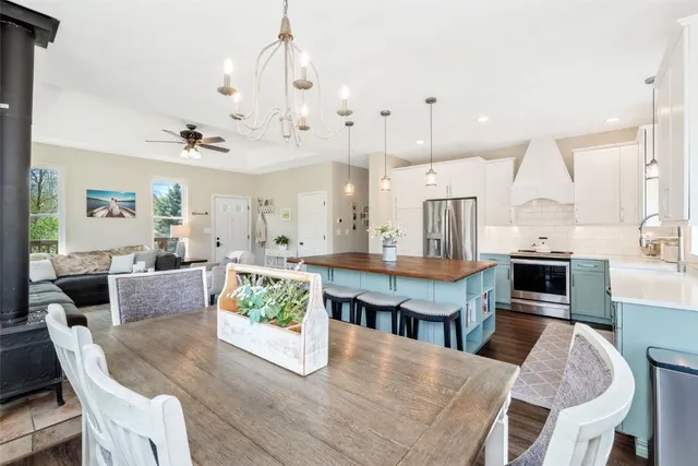 a living room with kitchen view and kitchen view