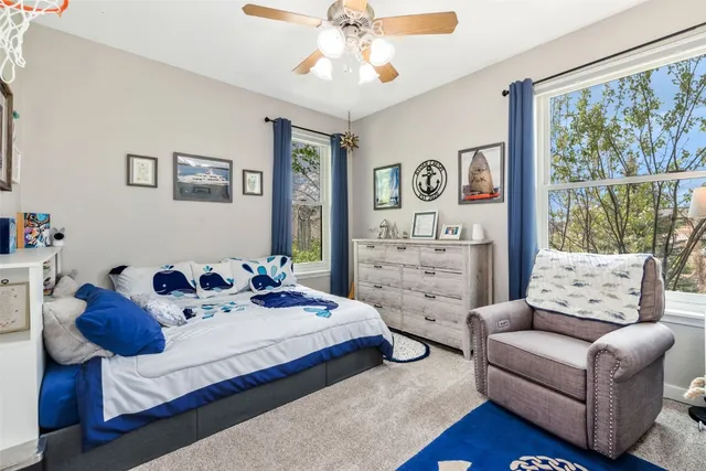 a bedroom with a bed and a couch