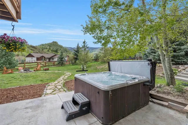 a view of a backyard with a garden and plants