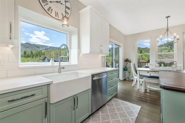 a kitchen with a sink and a large window