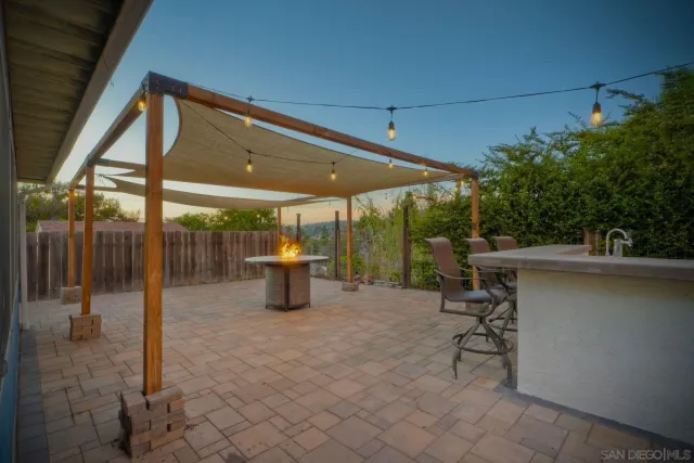 a view of a chairs and table in patio