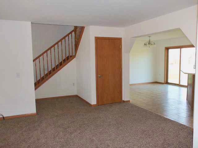 6738 Friday Road Byron, IL 61010 - Photo 8 of 25 a view of an entryway with wooden floor