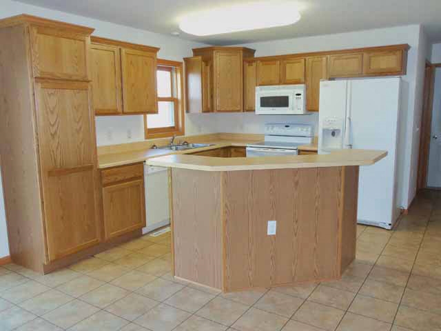 6738 Friday Road Byron, IL 61010 - Photo 10 of 25 a view of a kitchen with electric appliances