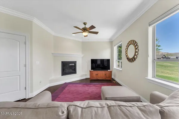 a bedroom with a bed couch and window