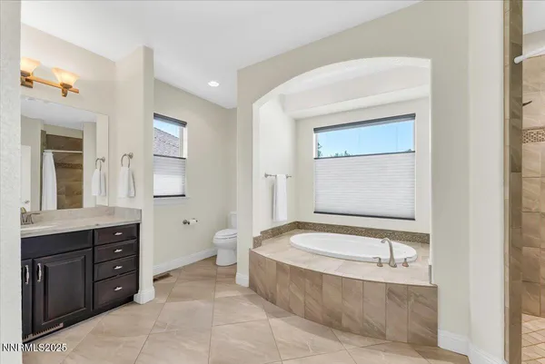 a bedroom with a bed dresser and a window