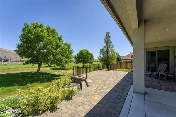 an aerial view of a house with outdoor space and a mountain view