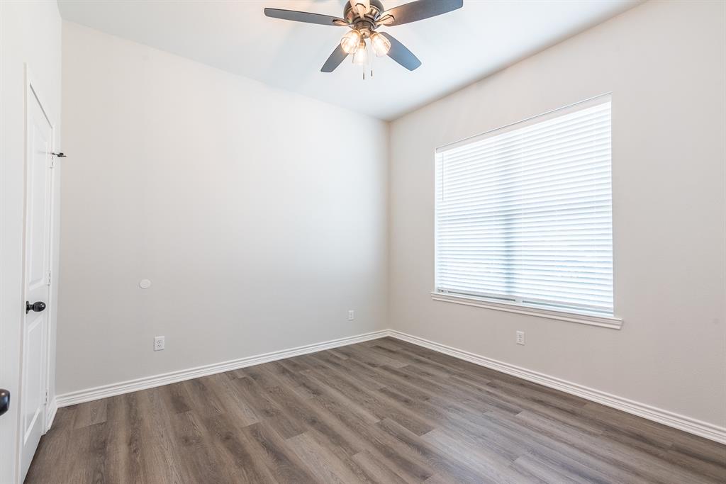 14151 County Road 192 Tyler, TX 75703 - Photo 12 of 28 an empty room with a window and a ceiling fan