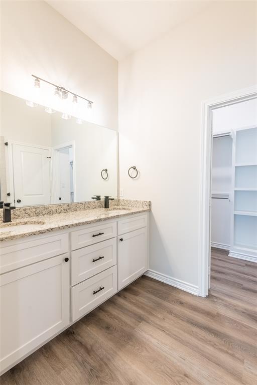 14151 County Road 192 Tyler, TX 75703 - Photo 20 of 28 a bathroom with a granite countertop double vanity sink and mirror