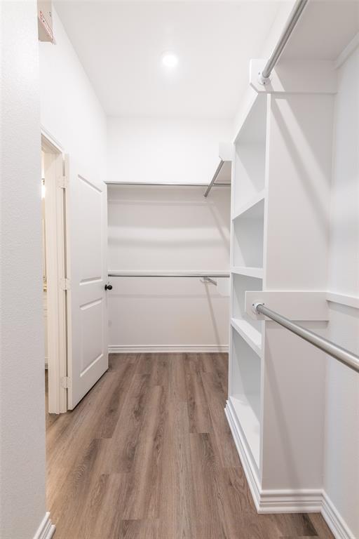 14151 County Road 192 Tyler, TX 75703 - Photo 22 of 28 a view of walk in closet with empty racks