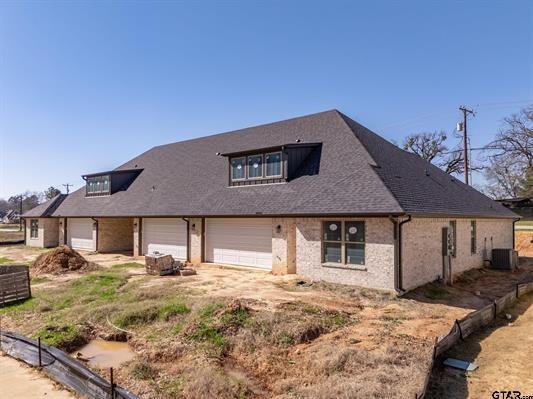14151 County Road 192 Tyler, TX 75703 - Photo 6 of 28 a front view of a house with garden