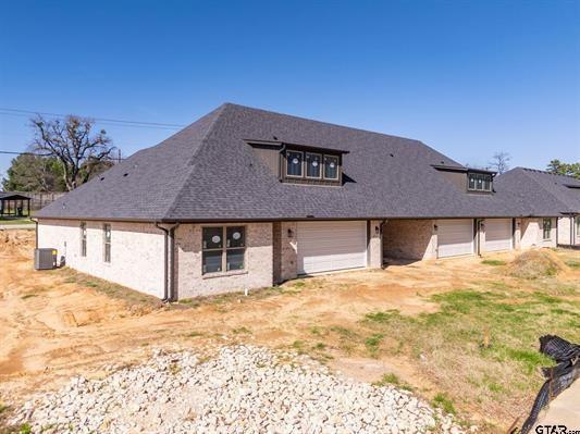 14151 County Road 192 Tyler, TX 75703 - Photo 7 of 28 a front view of a house with a yard