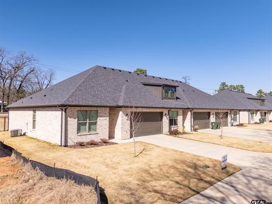 14151 County Road 192 Tyler, TX 75703 - Photo 8 of 28 a front view of a house with a yard