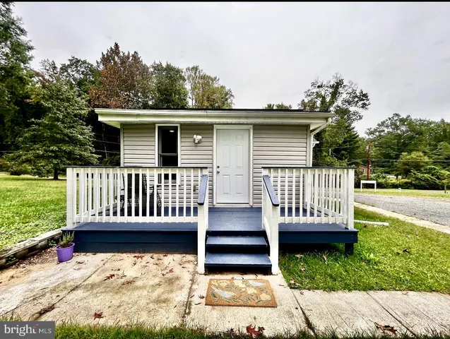 a view of a deck with a yard