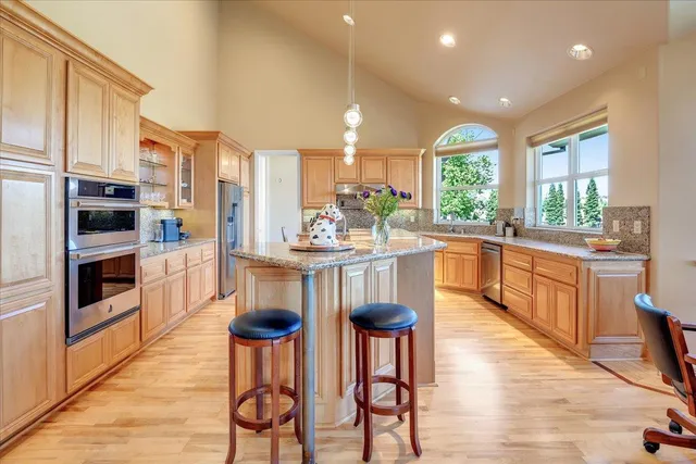 a dining room with furniture and window