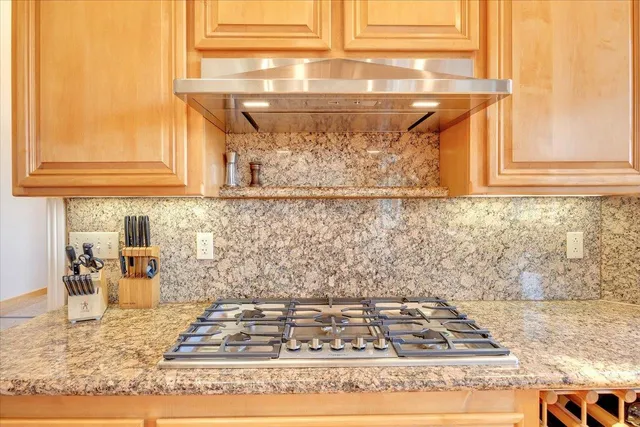 a living room with furniture fireplace and a large window