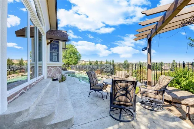 a bathroom with a granite countertop sink a mirror and shower