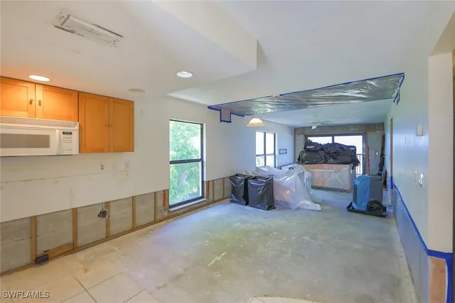 a large spacious bathroom with a large tub shower and fireplace