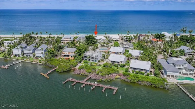 a view of a lake with a table and chairs