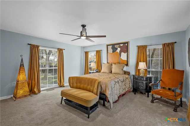 a bedroom with a bed and a couch