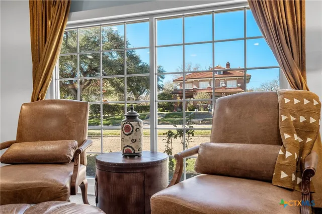 a living room with furniture and a window