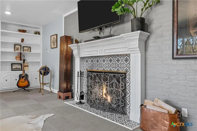 a room with furniture and a fireplace