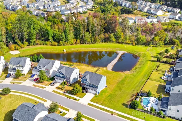 a view of swimming pool with a yard