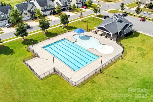 a view of a swimming pool with lounge chairs