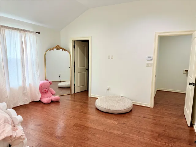 a view of a room that has a table and chair