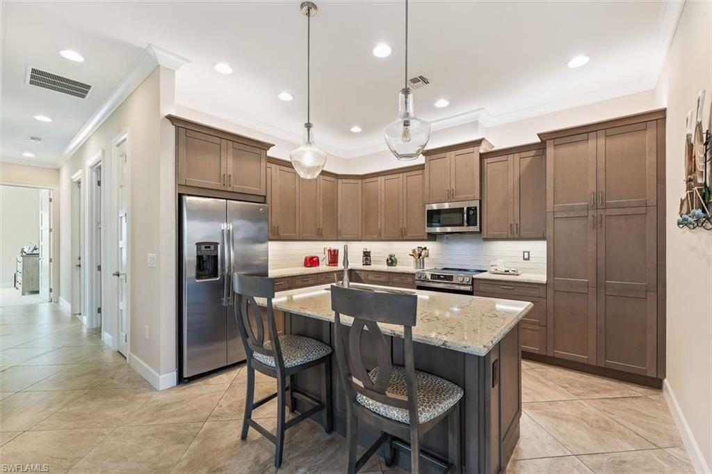 6931 Cay Court Naples, FL 34113 - Photo 24 of 24 Bird's eye view of a pool area