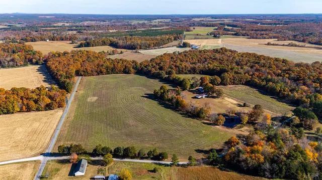 an aerial view of ocean and residential houses