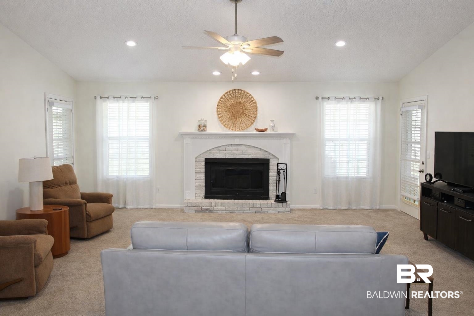 2538 Old Castleberry Road Brewton, AL 36426 - Photo 2 of 12 Living room with ceiling fan, light colored carpet, a brick fireplace, and recessed lighting