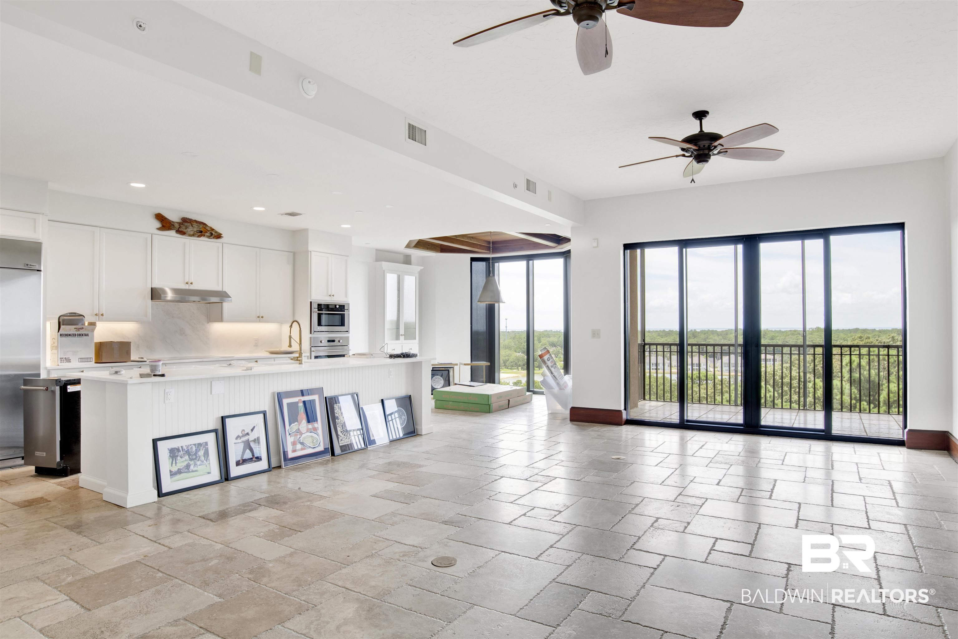 18269 Colony Drive, Unit 601 Fairhope, AL 36532 - Photo 3 of 47 Kitchen featuring white cabinetry, light tile patterned floors, plenty of natural light, and ceiling fan