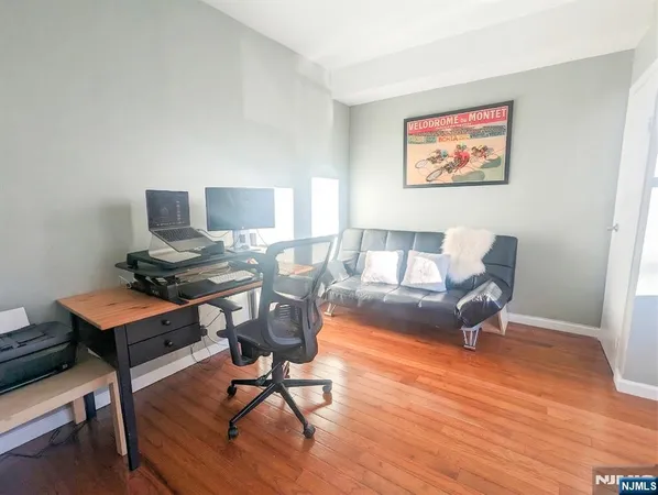a workspace with furniture and wooden floor