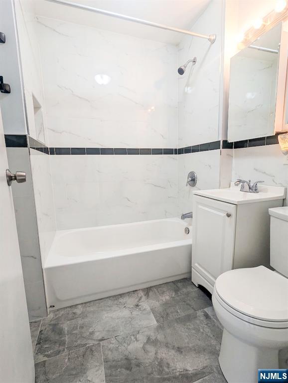 582 60th Street West New York, NJ 07093 - Photo 10 of 10 a bathroom with a toilet a sink and bathtub