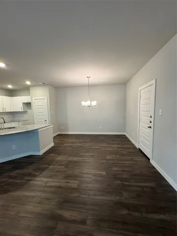 a view of a kitchen counter space and wooden floor