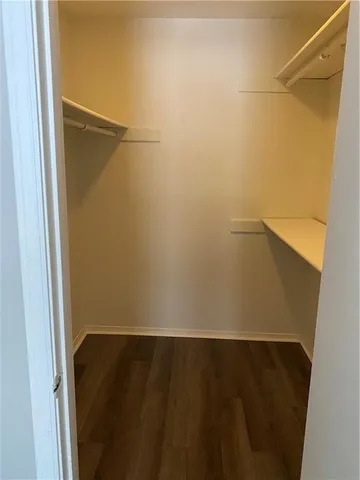 a view of an empty walk in closet