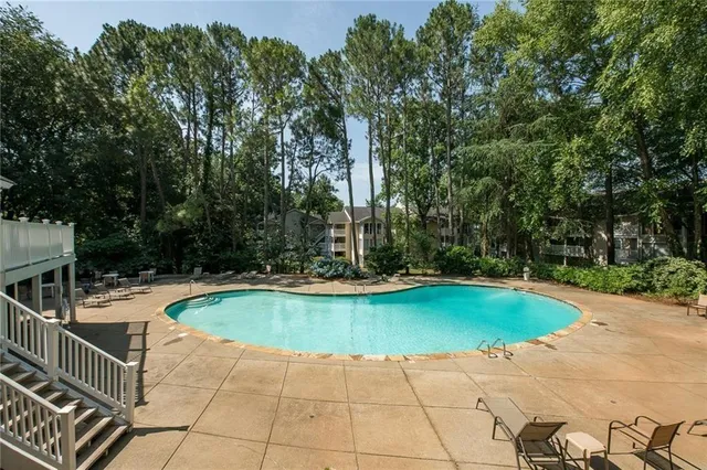 a view of a swimming pool with a patio