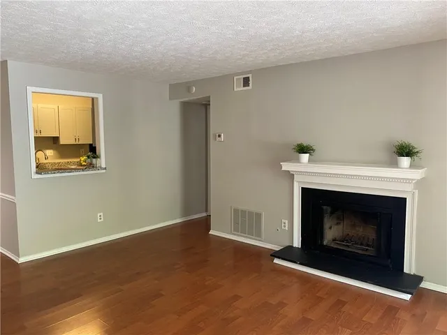 a living room with a fireplace