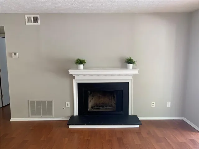 a living room with a fireplace