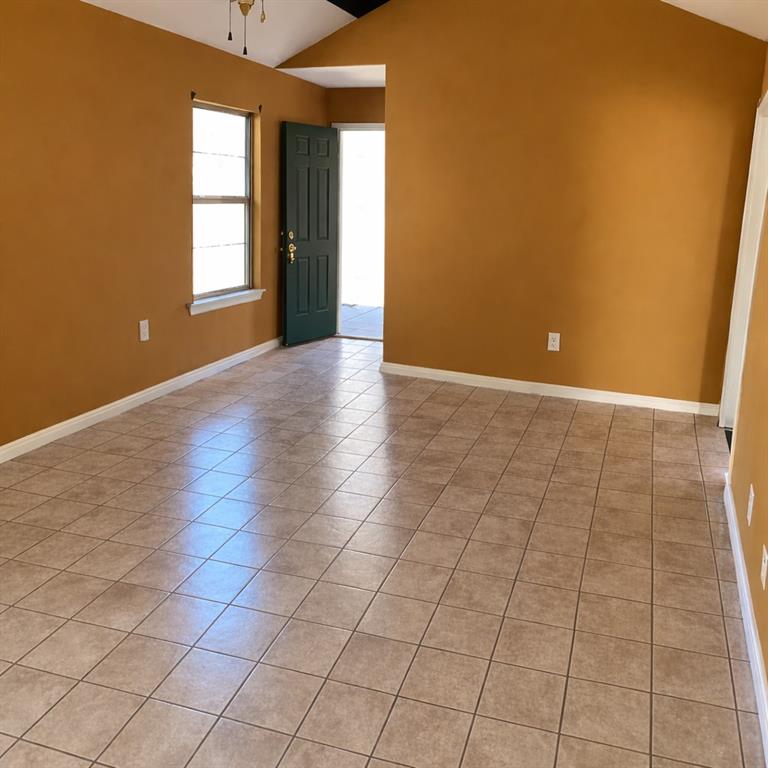 141 McRae Street Atmore, AL 36502 - Photo 3 of 25 an empty room with windows