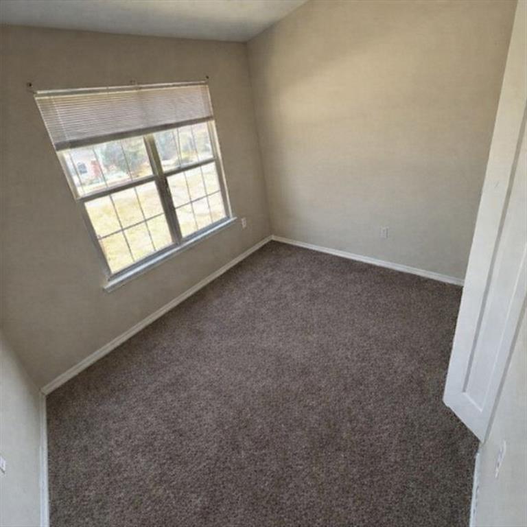 141 McRae Street Atmore, AL 36502 - Photo 7 of 25 an empty room with a window