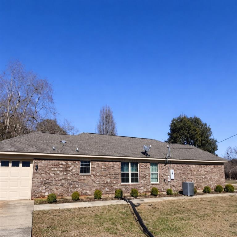 141 McRae Street Atmore, AL 36502 - Photo 8 of 25 front view of a house with two chairs