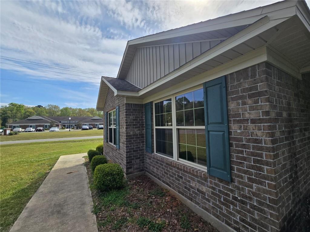 141 McRae Street Atmore, AL 36502 - Photo 10 of 25 a house with garden in front of it