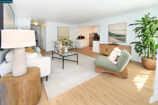a living room with furniture and a lamp